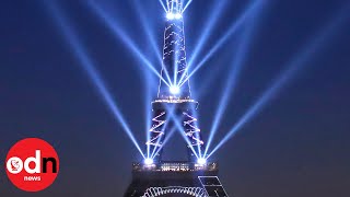 Eiffel Tower celebrates 130th birthday with laser show [upl. by Abernon]